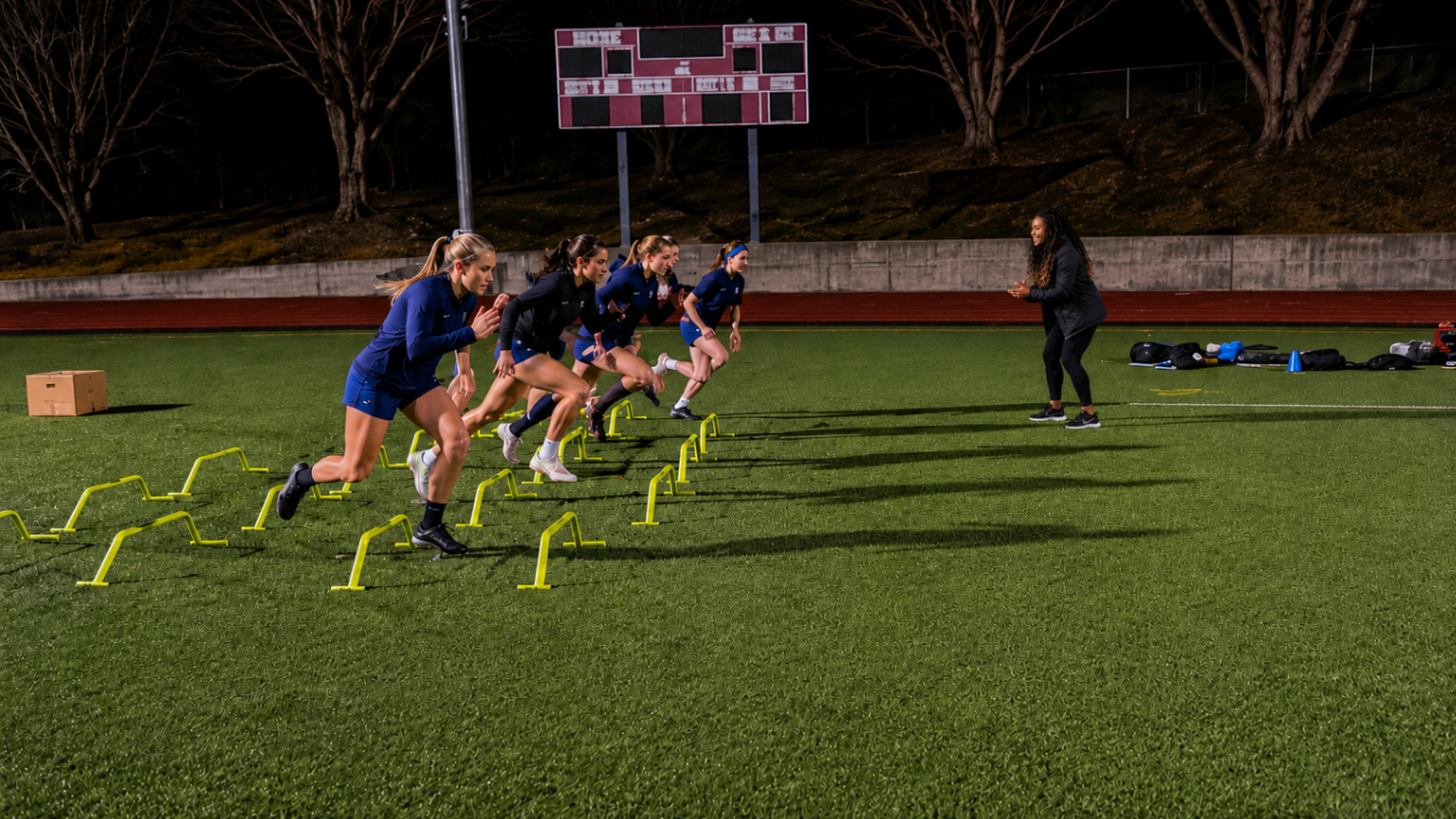 Coach Jo leading team sprint and acceleration drills with high school athletes